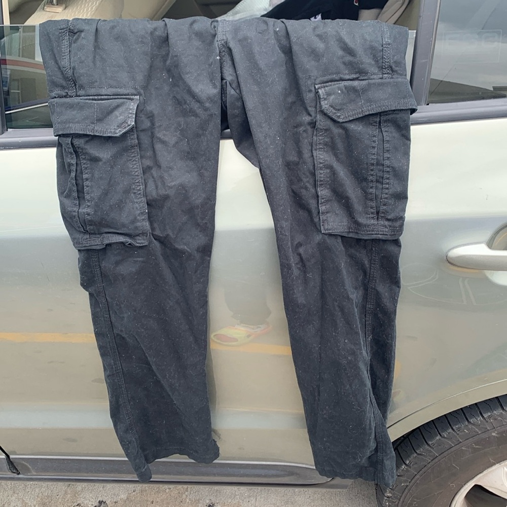 Some old black cargo pants can’t fit no more tryna get rid of them